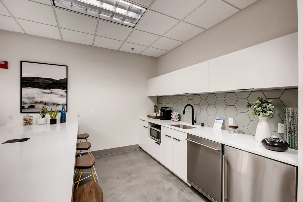 Clubhouse lounge with kitchenette, and bar height seating