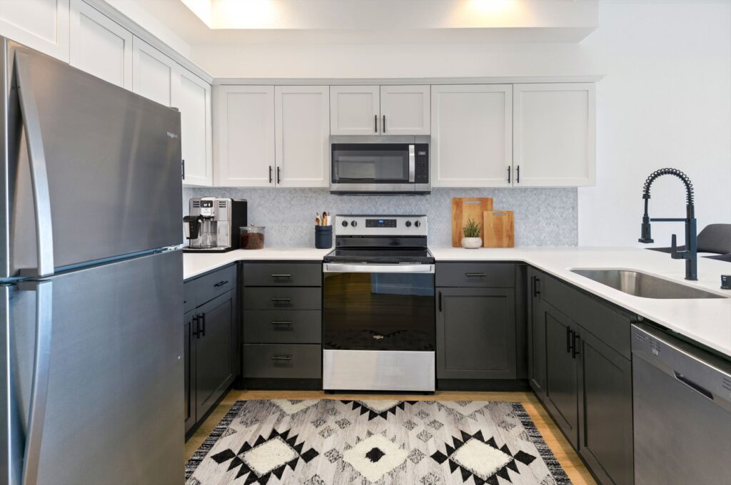 A well-equipped kitchen featuring stainless steel appliances for a professional look, complemented by clean white cabinets. Newly Renovated apartment